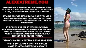 Proxy Paige in micro bikini fist her bum & prolapse on the beach
